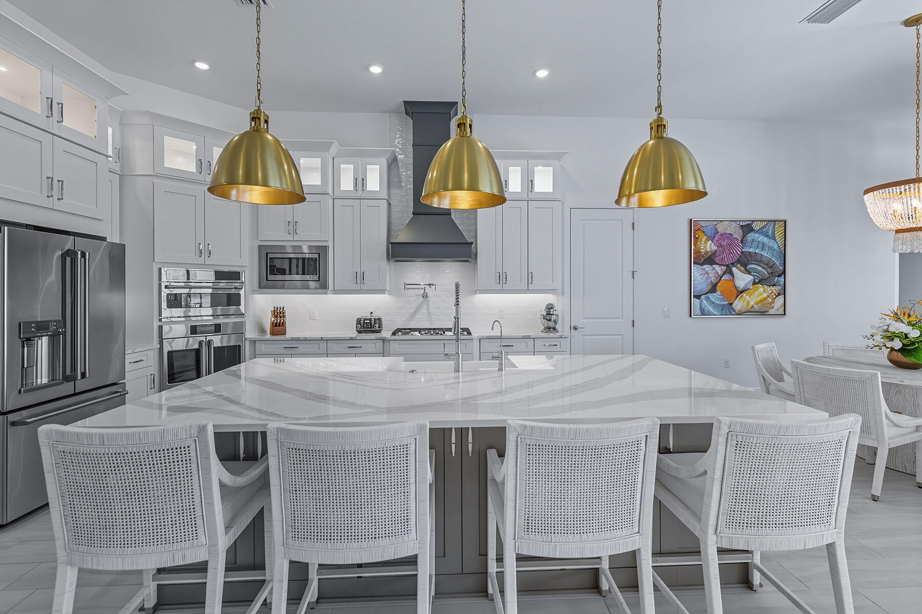 15326 Turin Drive Naples, FL 34114 - Photo 8 of 50 a kitchen with stainless steel appliances granite countertop a sink and a refrigerator