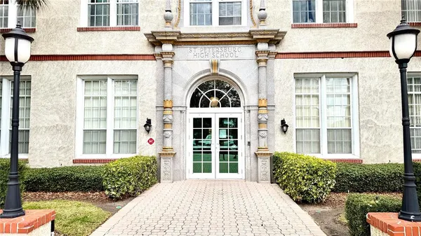 front view of a brick house with a large windows