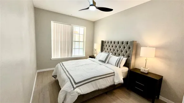 a bedroom with a bed and window