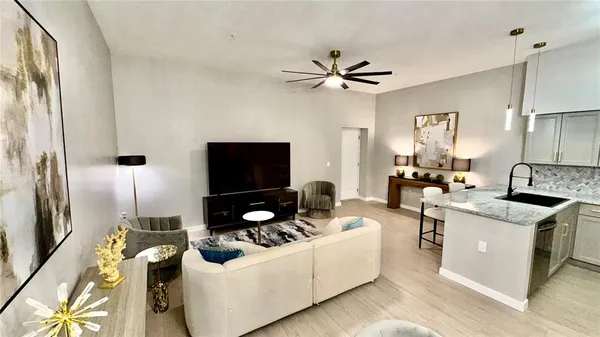 a living room with furniture and a flat screen tv