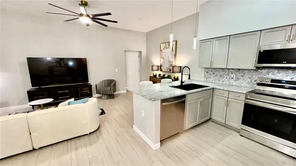 a kitchen with a sink stove and microwave