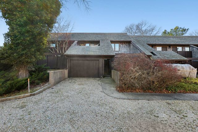 a view of a house with a yard and plants