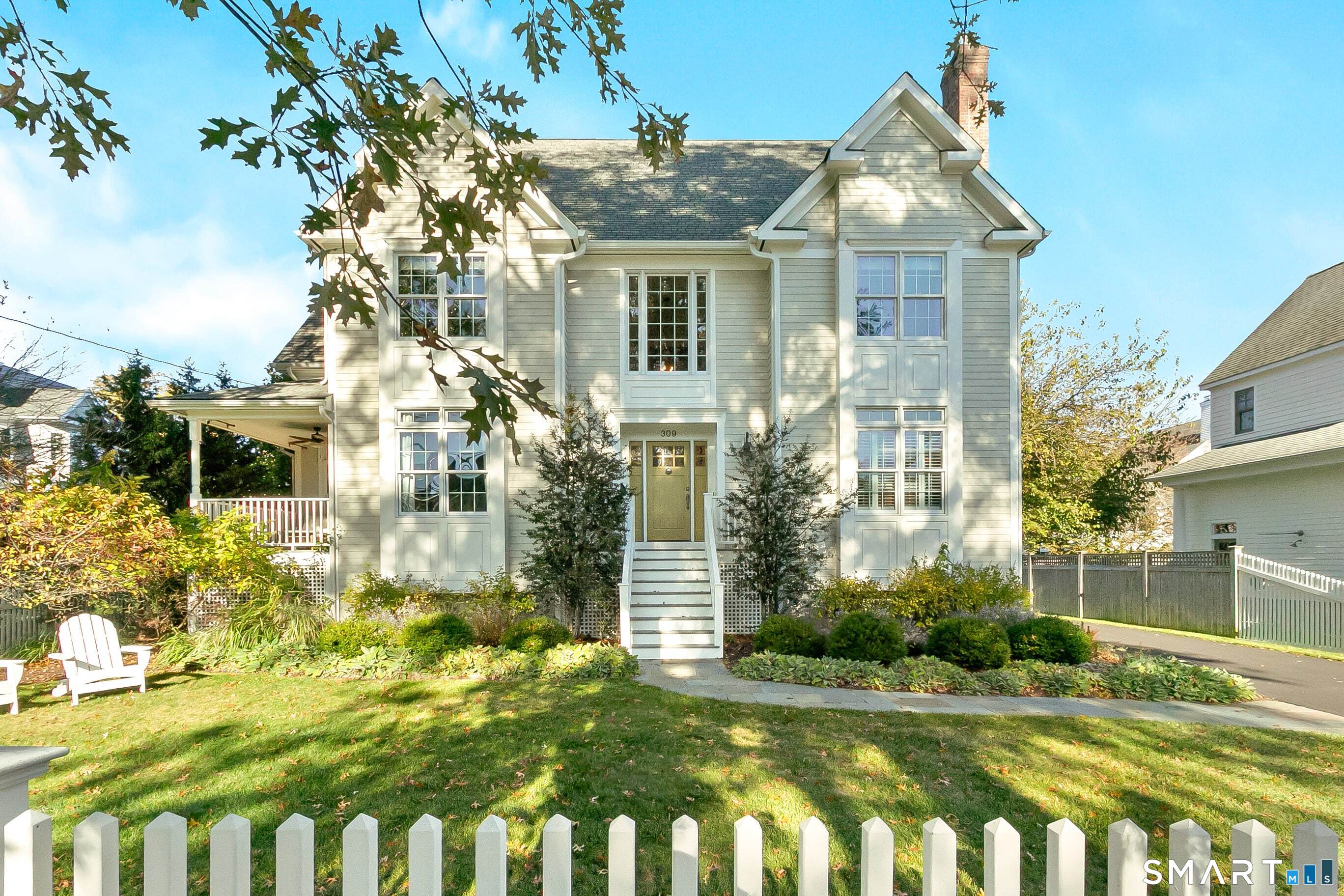 309 Birch Road Fairfield, CT 06824 - Photo 1 of 1 a front view of a house with a garden