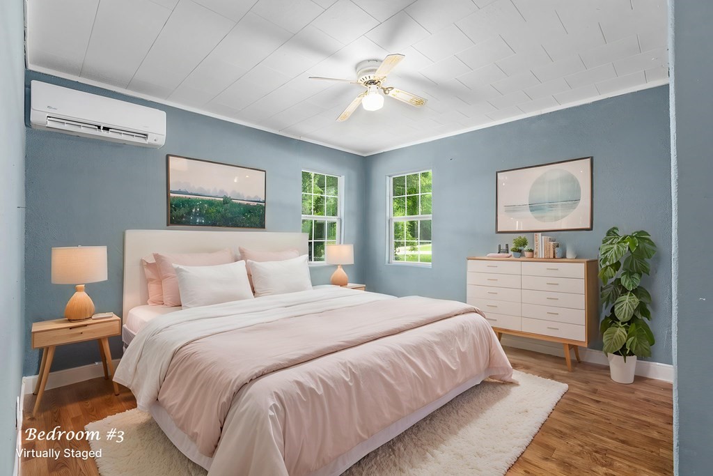 2915 Freeman Street Lufkin, TX 75901 - Photo 8 of 33 a bedroom with a large bed and a chandelier