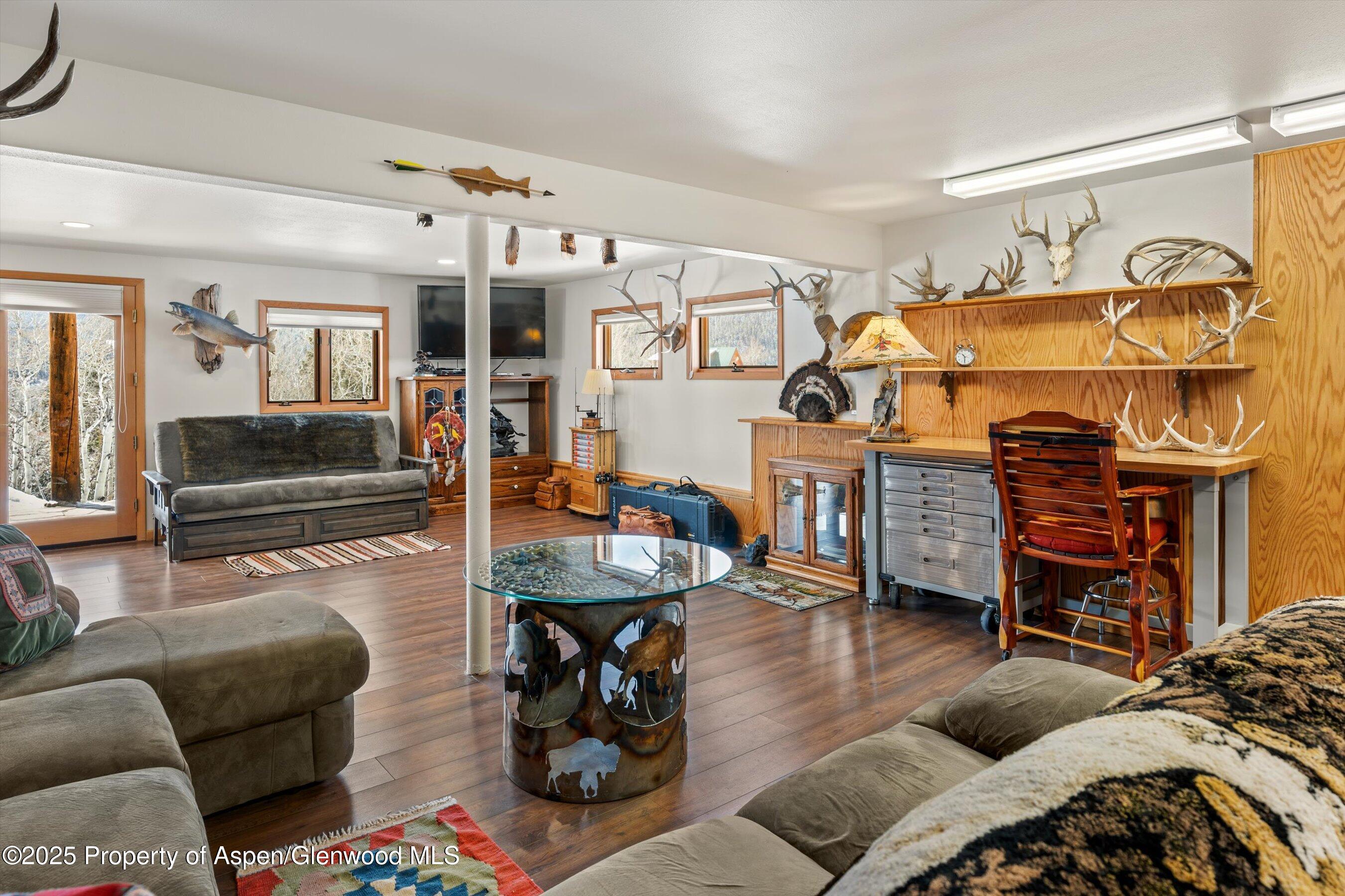 238 Hawk Lane Basalt, CO 81621 - Photo 33 of 46 a living room with furniture and wooden floor