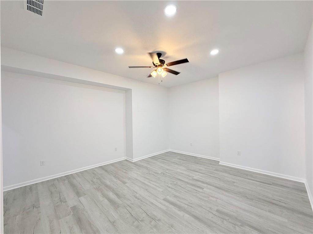 44 Dew Lk Court Grayson, GA 30017 - Photo 11 of 16 a view of an empty room with a ceiling fan