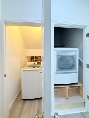 a living room with a washer and dryer