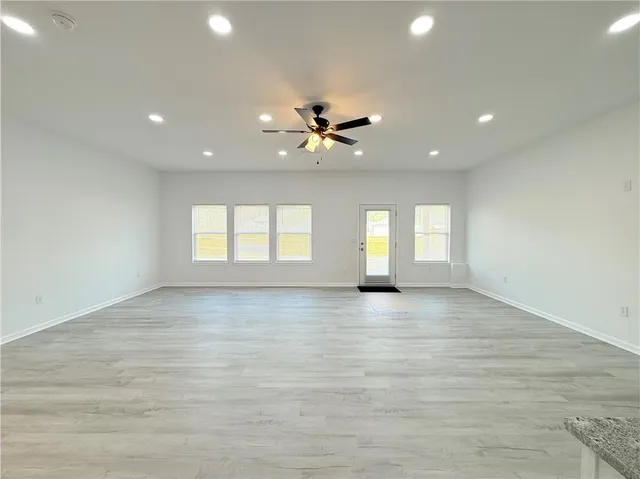 a view of an empty room with a window