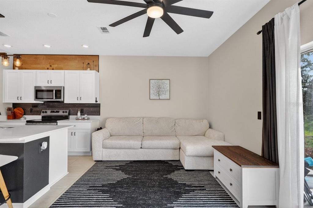 350 River Front Way Edgewater, FL 32141 - Photo 16 of 46 a living room with furniture and a rug