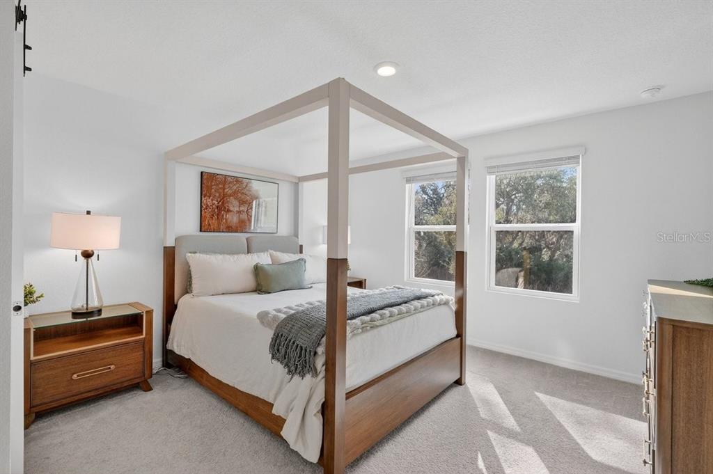 350 River Front Way Edgewater, FL 32141 - Photo 20 of 46 a bedroom with a bed and a window