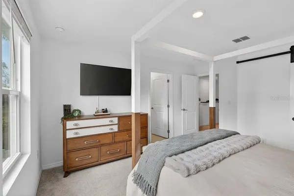 a bathroom with a shower sink vanity and toilet