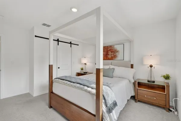 a bedroom with a bed and a dresser