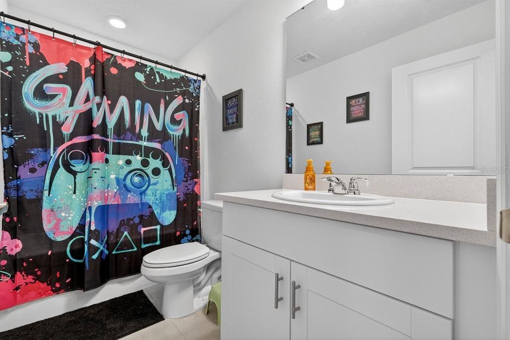 350 River Front Way Edgewater, FL 32141 - Photo 26 of 46 a bathroom with a toilet sink and mirror