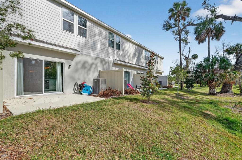 350 River Front Way Edgewater, FL 32141 - Photo 30 of 46 a front view of a house with a garden