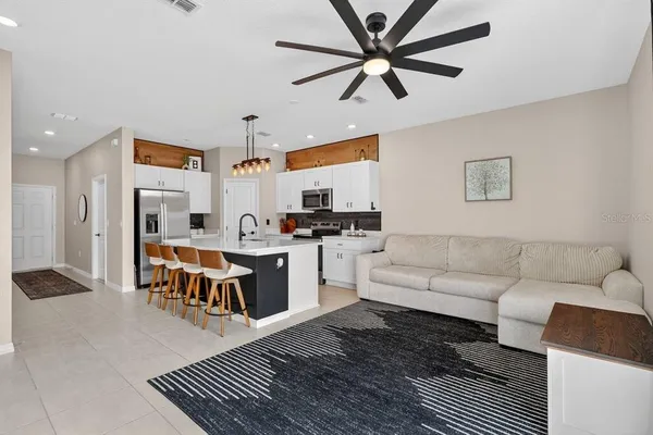 a kitchen with stainless steel appliances a refrigerator and a stove