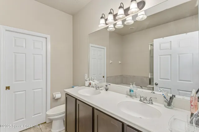 a bathroom with a sink vanity and a mirror