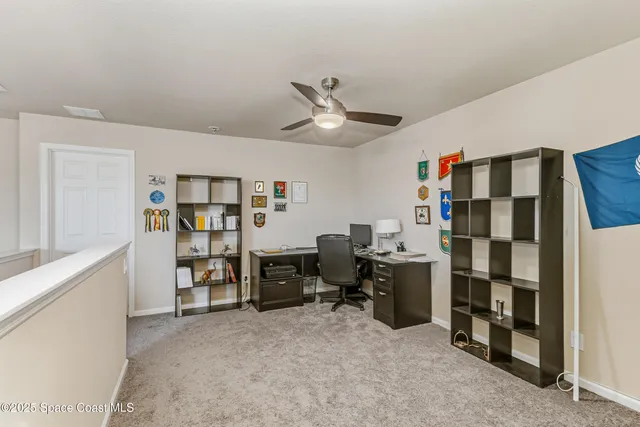 a view of a workspace with furniture