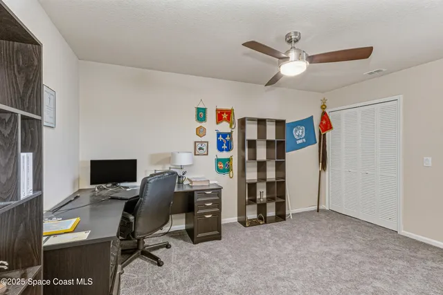 a view of a workspace with furniture