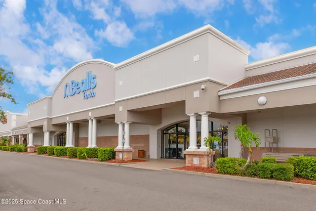 a view of a street with stores