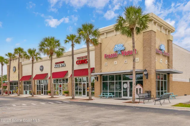 a view of a street with a building in the background