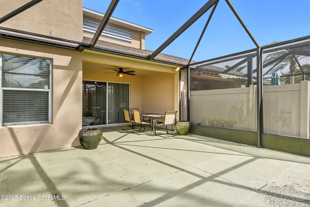 a patio with a table and chairs