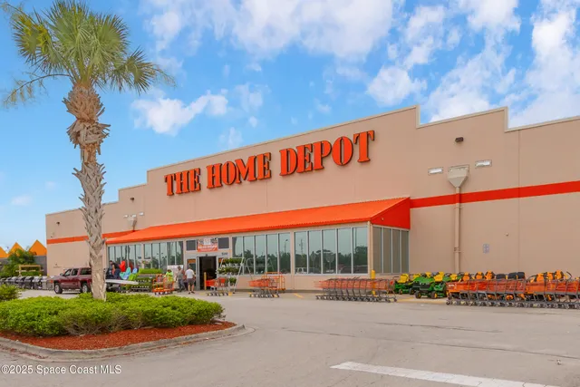 a view of a cars park in front of building