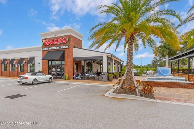 a front view of a multi story residential apartment building