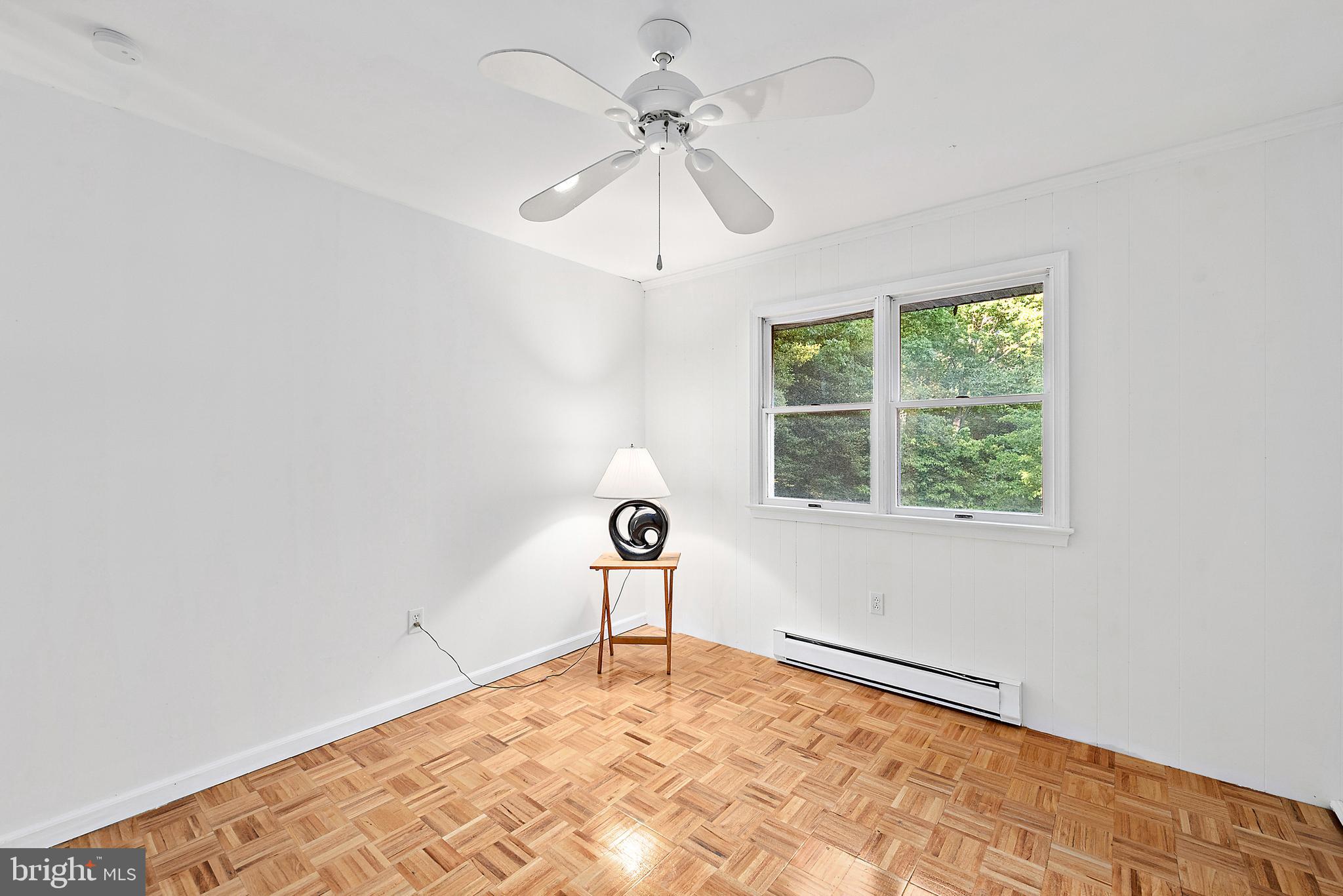 6181 Rockawalkin Road Salisbury, MD 21801 - Photo 30 of 65 a view of a livingroom with a window and a ceiling fan