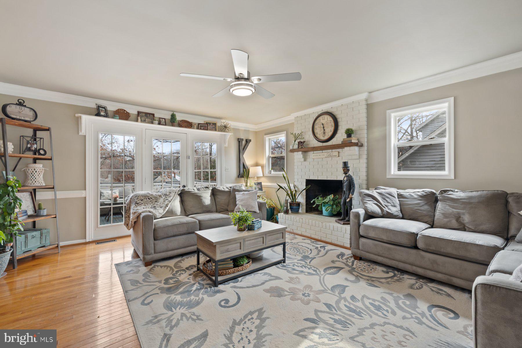 15 Tarleton Way Stafford, VA 22554 - Photo 30 of 74 a living room with furniture a fireplace and a large window