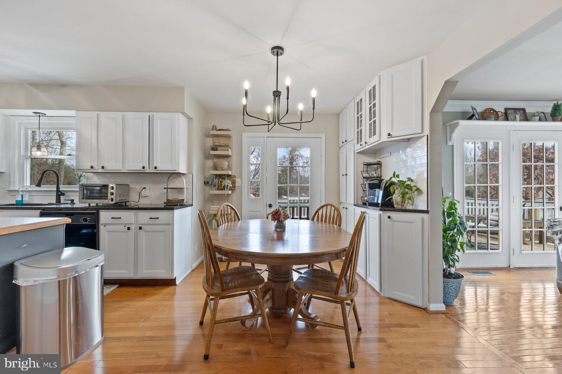 15 Tarleton Way Stafford, VA 22554 - Photo 33 of 74 a kitchen with stainless steel appliances a dining table chairs and chandelier