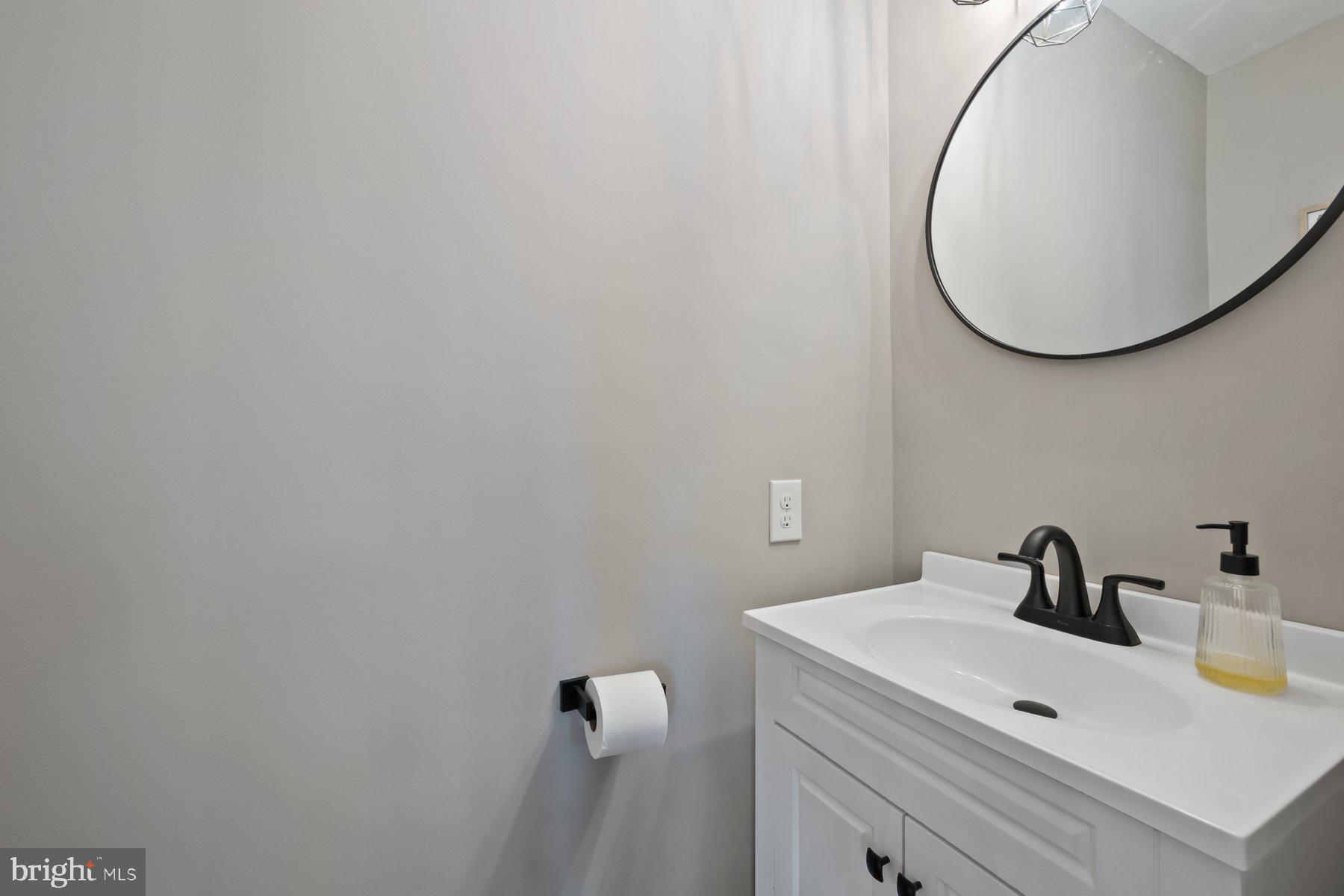 15 Tarleton Way Stafford, VA 22554 - Photo 39 of 74 a bathroom with a sink and a mirror