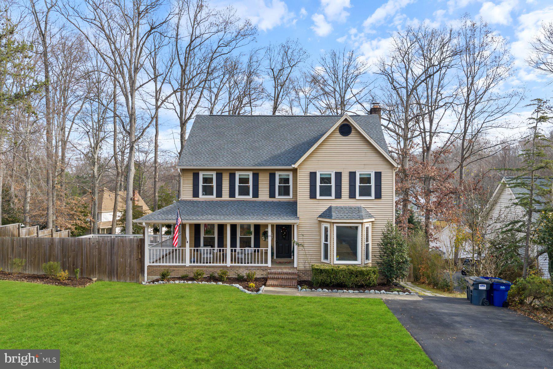 15 Tarleton Way Stafford, VA 22554 - Photo 5 of 74 a front view of a house with a garden and trees
