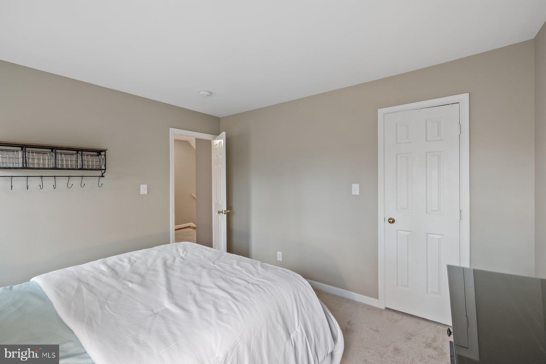 15 Tarleton Way Stafford, VA 22554 - Photo 51 of 74 a bedroom with a bed and a mirror