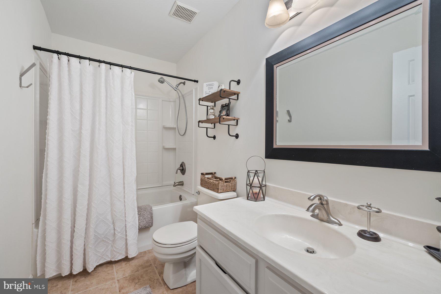 15 Tarleton Way Stafford, VA 22554 - Photo 52 of 74 a bathroom with a sink vanity mirror and toilet