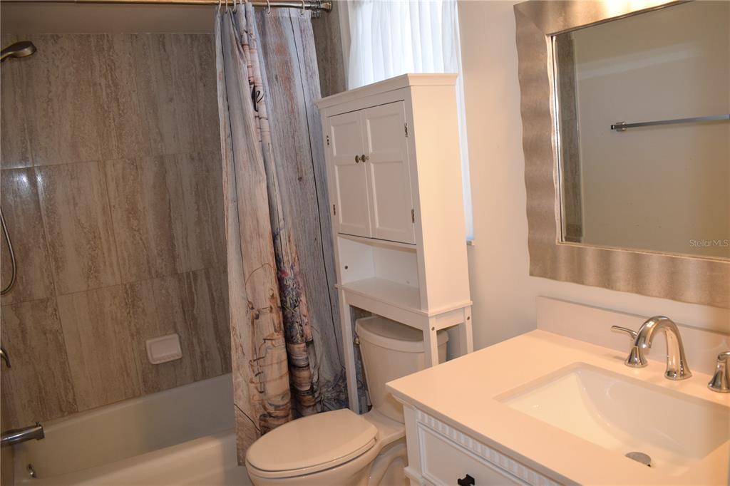 245 Center Road, Unit 104 Venice, FL 34285 - Photo 33 of 37 a bathroom with a sink toilet and shower