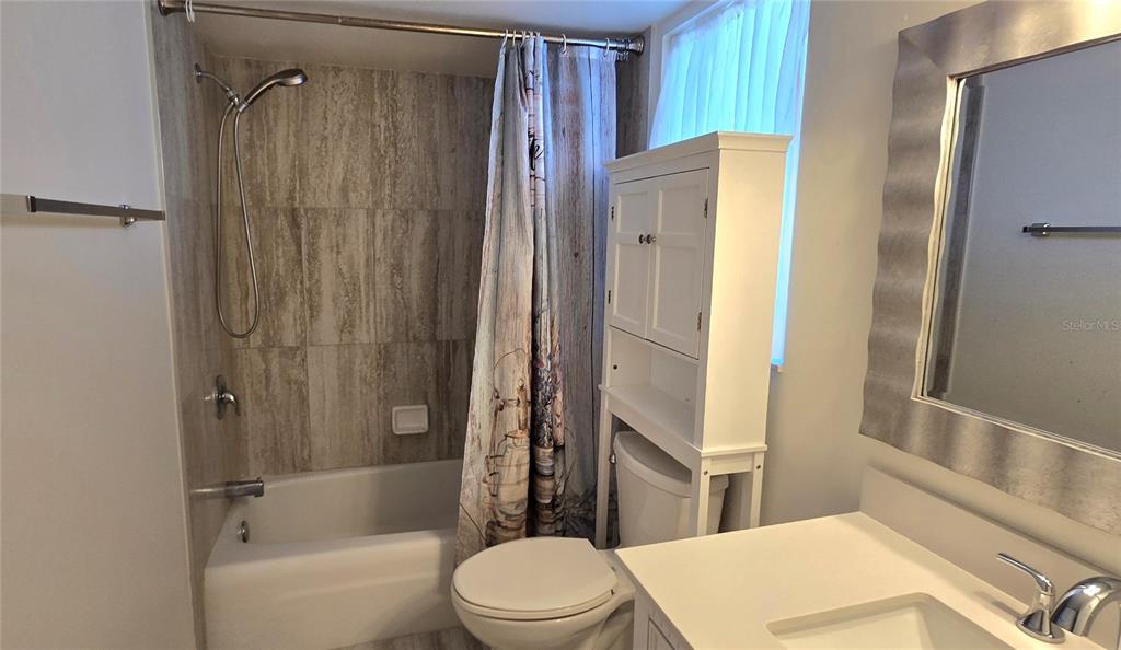 245 Center Road, Unit 104 Venice, FL 34285 - Photo 34 of 37 a bathroom with a toilet and shower