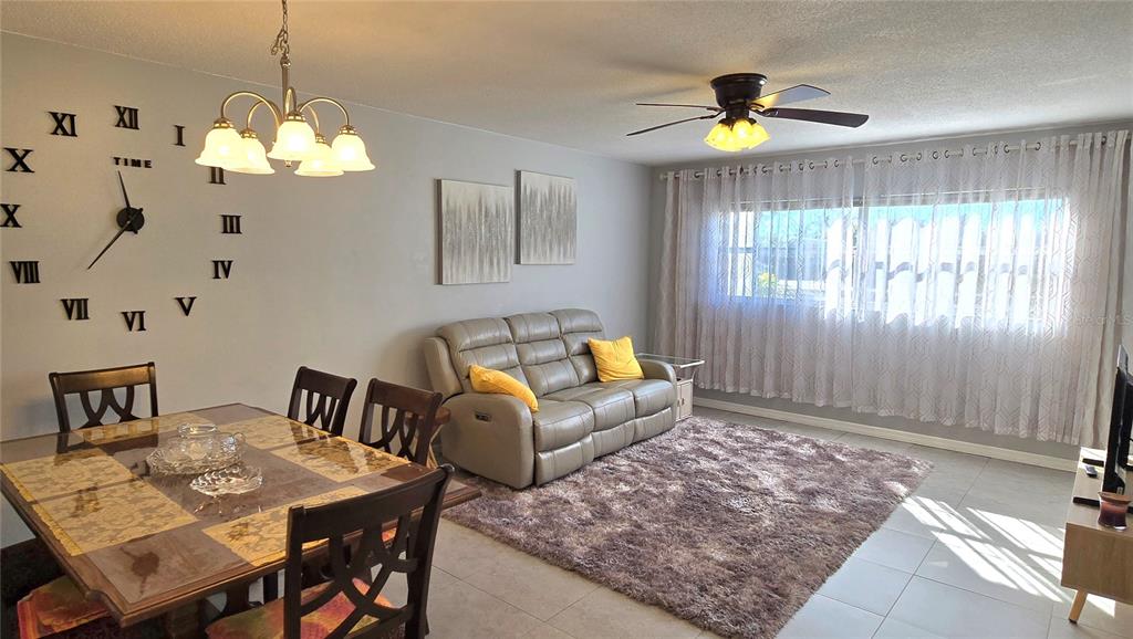 245 Center Road, Unit 104 Venice, FL 34285 - Photo 4 of 37 a view of a dining room with furniture and window