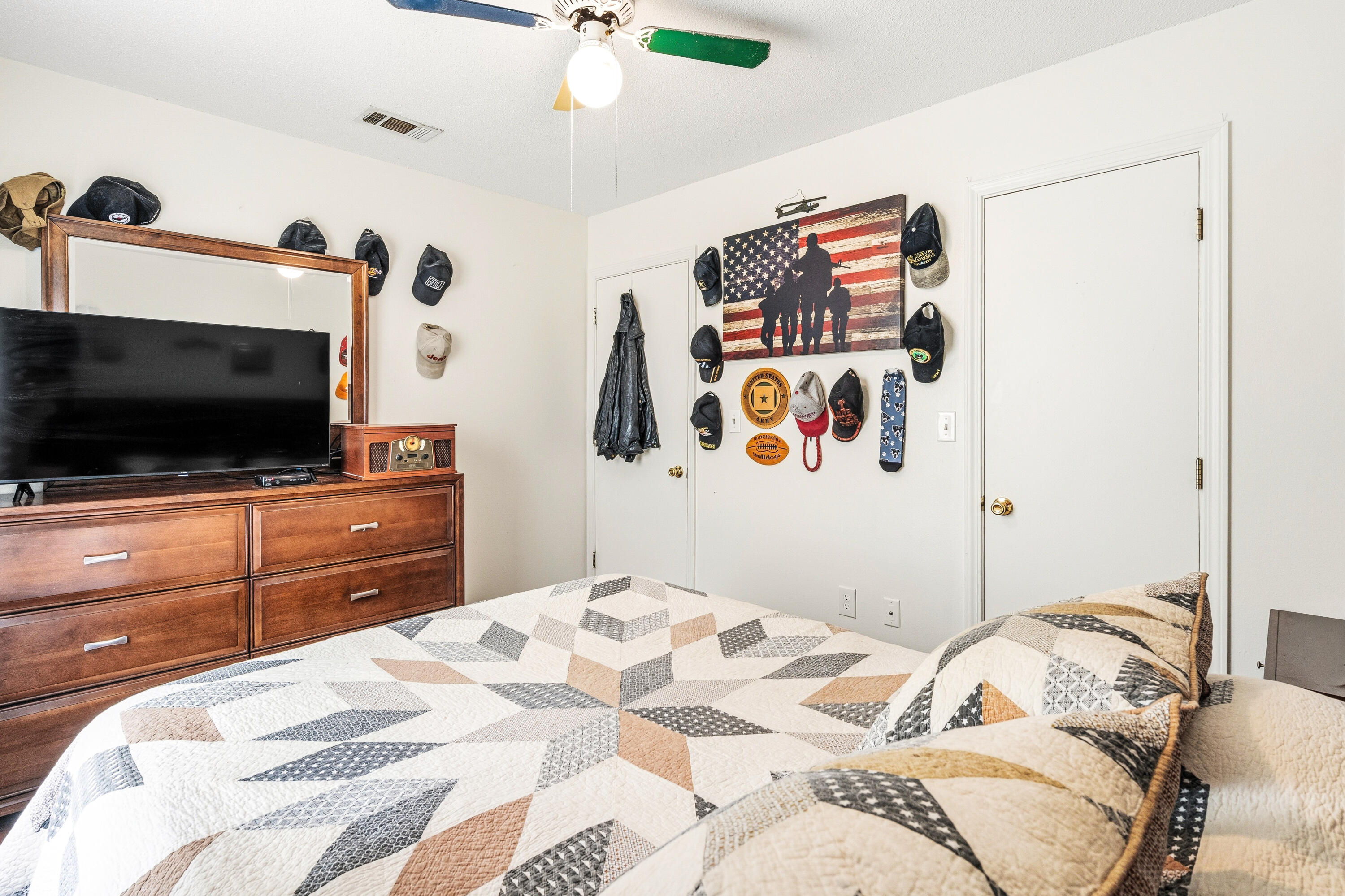 2880 Aplin Road Crestview, FL 32539 - Photo 21 of 33 a bedroom with a bed and a flat screen tv