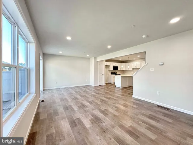 a view of a kitchen with a sink and a stove top oven