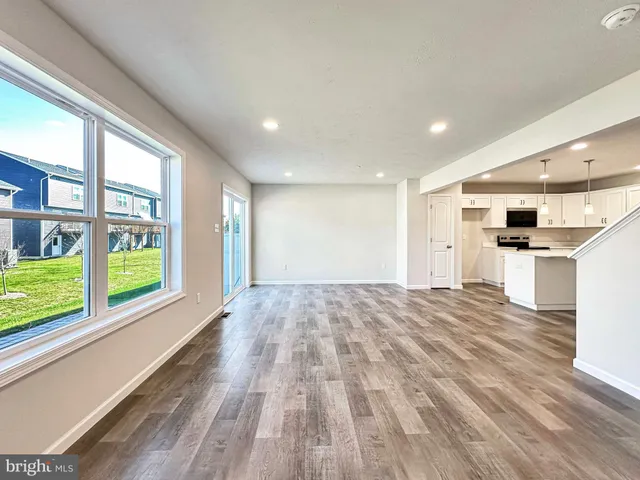 a kitchen with a sink stove and white cabinets
