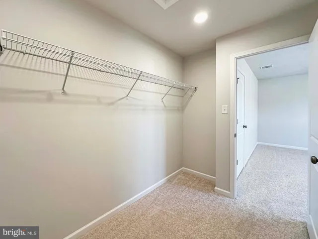 a view of a bathroom with a glass door and a bathroom