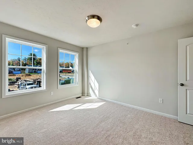 a view of a room with wooden walls