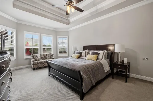 a bedroom with a bed and a couch