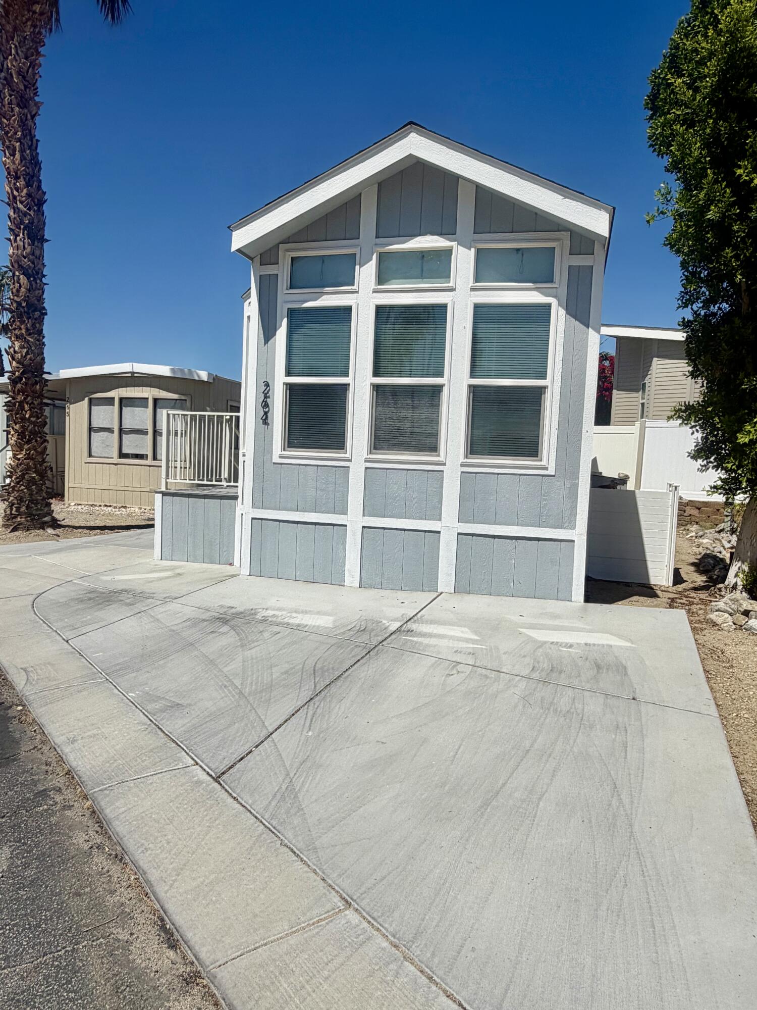 74711 Dillon Road, Unit 264 Desert Hot Springs, CA 92241 - Photo 2 of 21 a view of a house with a backyard