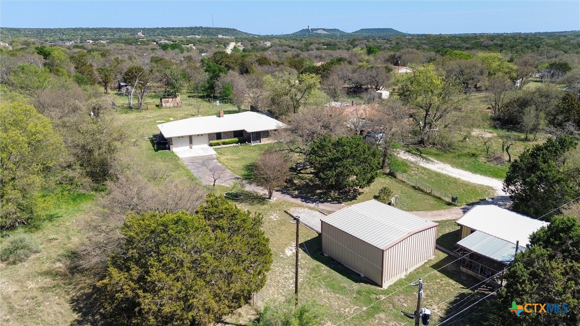 an aerial view of a house with a garden