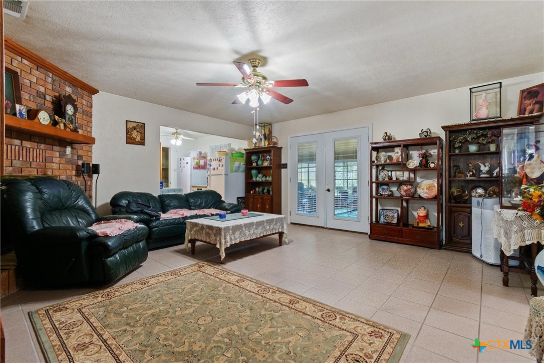 3037 Boys Ranch Road Kempner, TX 76539 - Photo 12 of 47 a living room with furniture and a book shelf