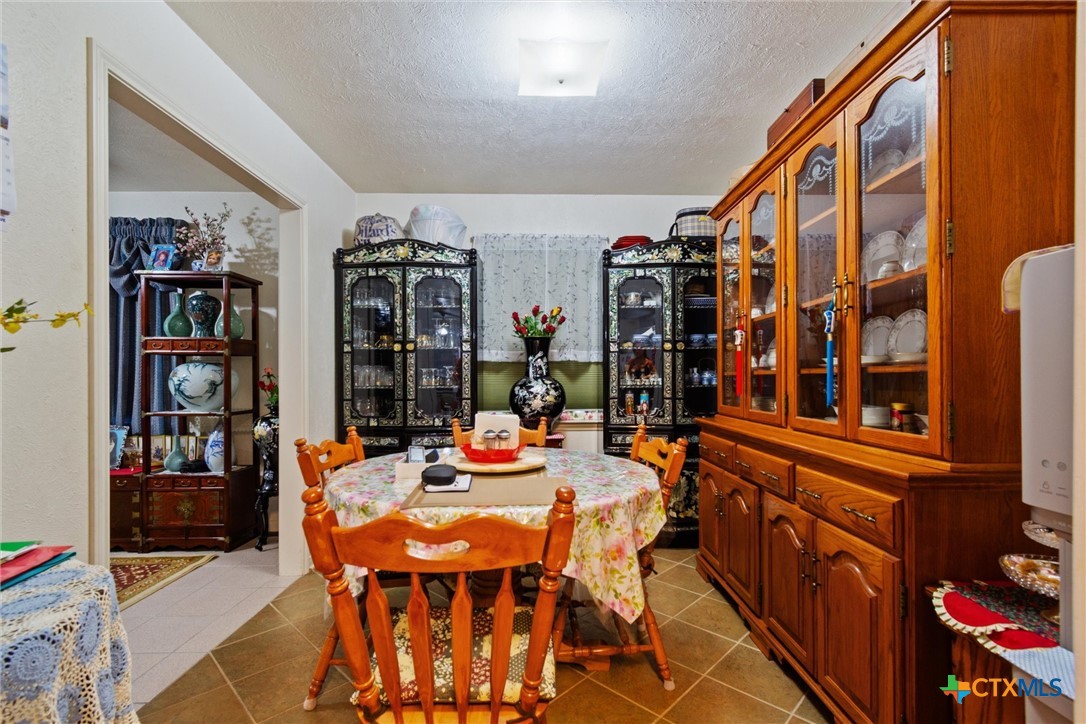 3037 Boys Ranch Road Kempner, TX 76539 - Photo 13 of 47 a view of a dining room with furniture and chandelier