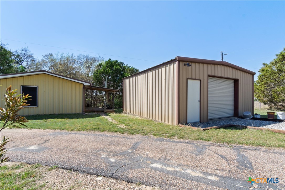 3037 Boys Ranch Road Kempner, TX 76539 - Photo 28 of 47 a front view of a house with a yard and garage