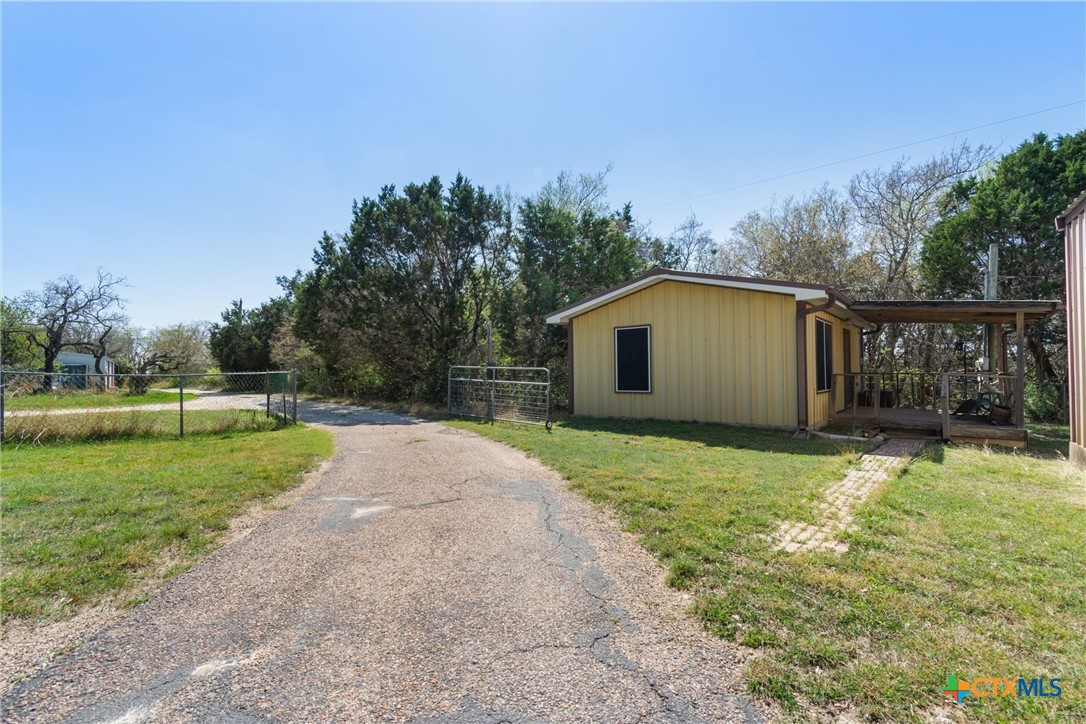 3037 Boys Ranch Road Kempner, TX 76539 - Photo 30 of 47 a backyard of a house with lots of green space and garden