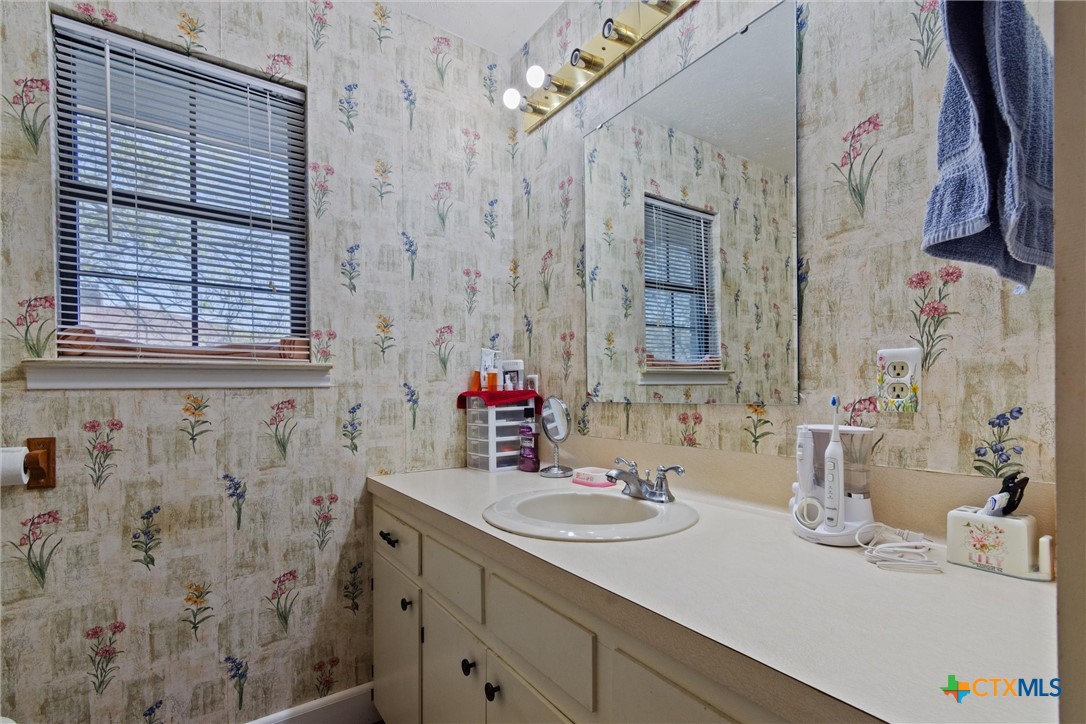 3037 Boys Ranch Road Kempner, TX 76539 - Photo 32 of 47 a bathroom with a sink vanity and a mirror
